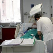 Nursing professionals care for a patient.