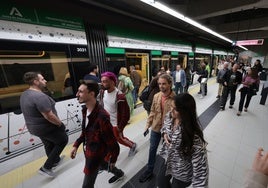 File image of passengers on a busy Malaga metro station platform.