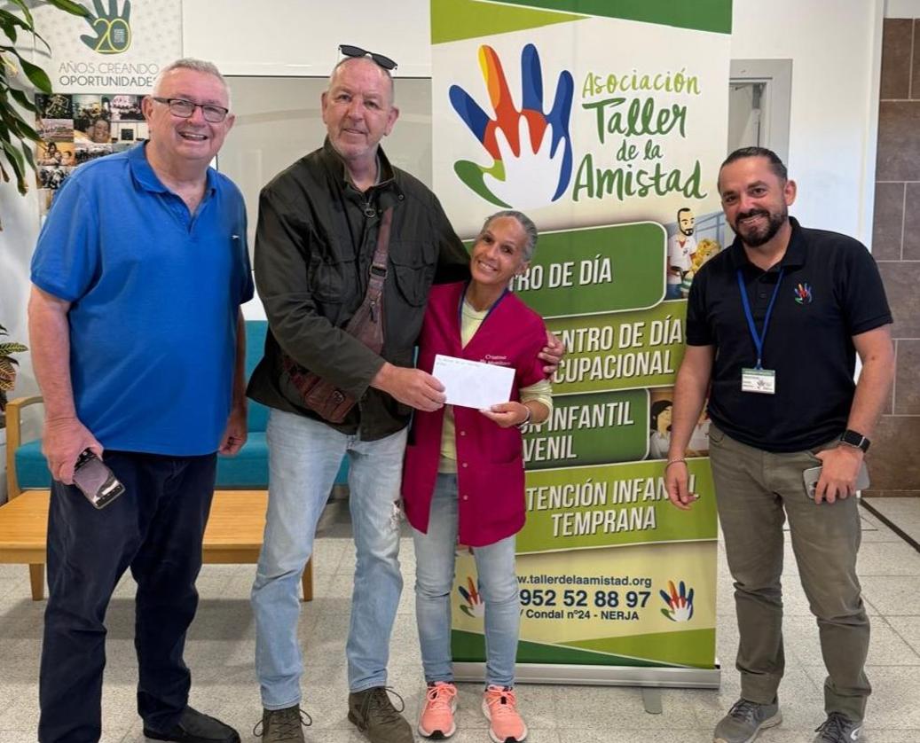 The handing over of the cheque.