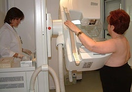 A woman undergoes a preventive mammogram.