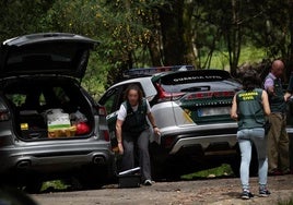 The Guardia Civil on-site where the burnt vehicle with the two bodies inside was found.
