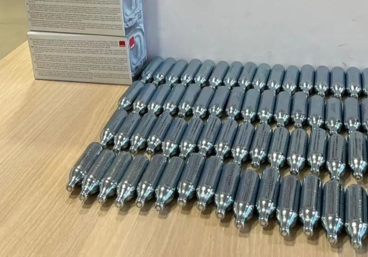 The canisters of nitrous oxide seized during the police action.