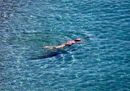 A bather on a beach in Malaga.