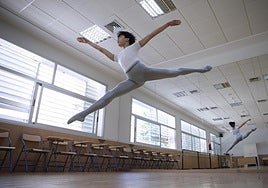 Noah, performing a jump, in a room provided for the photoshoot by ESAD.