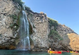 Canoes next to the Cascada Grande de Maro waterfall.