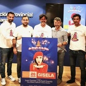Organisers and collaborators pose with the poster for the event.