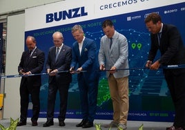 Authorities and Bunzl heads cut the ribbon at the logistics centre on Monday.