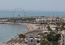 Photo of the Malaga coastline, with Puerto Marina in the background.