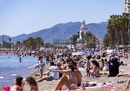 Hordes of people enjoy a beach day at La Malagueta in Malaga city (file image).