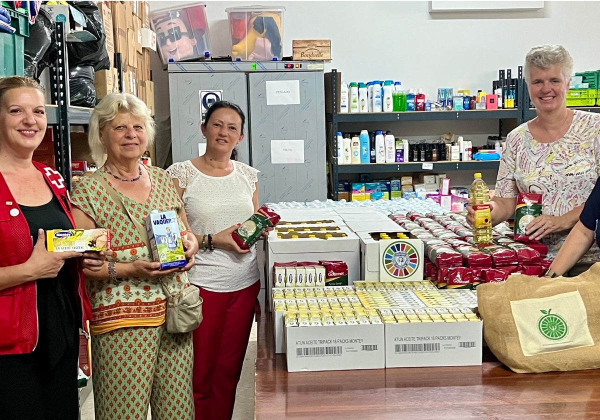 Soroptimist members with the donation of basic food supplies.