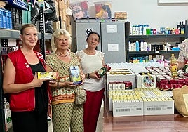 Soroptimist members with the donation of basic food supplies.
