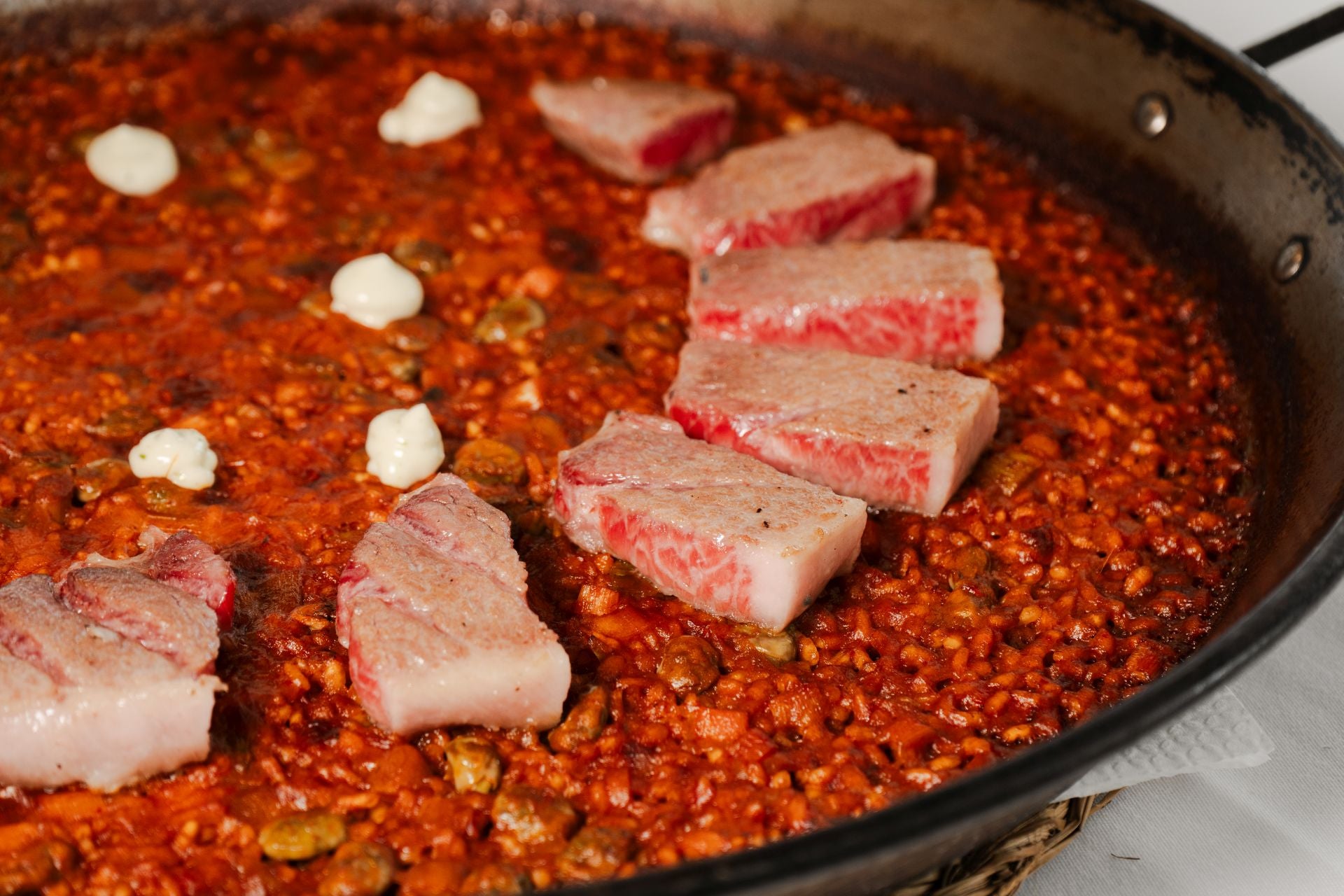 Tuna belly paella with broad beans from La Carihuela Chica.
