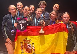 The triumphant youngster in Birmingham with their gold trophy.