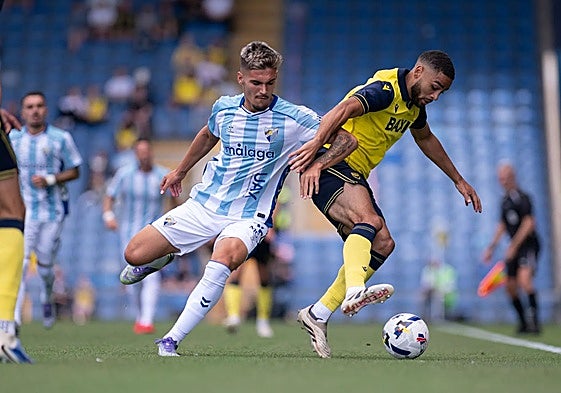 Malaga were playing their first game abroad for eight years.