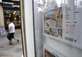 A property for sale advertised in a real estate agency in A Coruña.