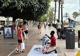 Street vendors working on the promenade in Marbella this summer.