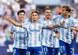 Larrubia celebrates making it 1-0 with his teammates.