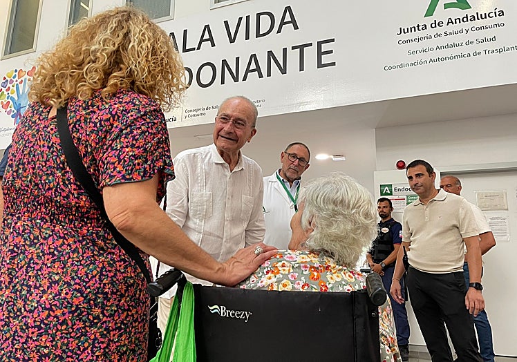 The mayor greets one of the patients.