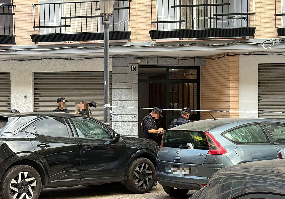 Several police officers in the street where the incident happened.