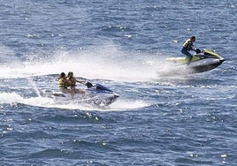 Jet skis are being monitored to ensure safety of bathers.