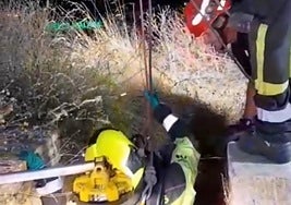 Firefighters at the well where David Ruiz's body was found.