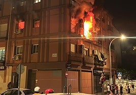 Residents leave the building by climbing down from a balcony.