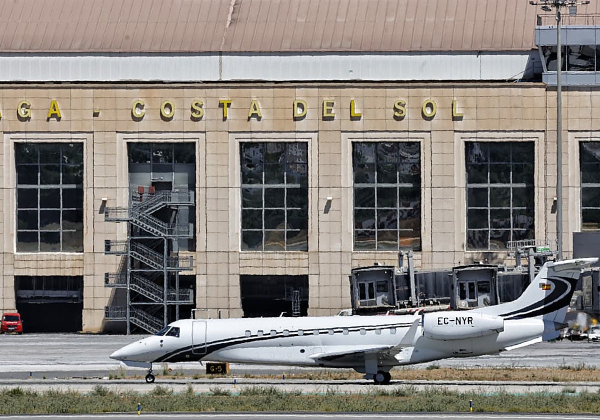 Executive jet in front of one of the terminals at Malaga Airport.