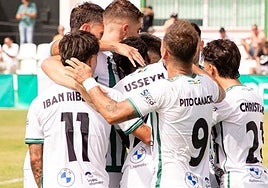 The Torremolinos players celebrate their first goal on Sunday.