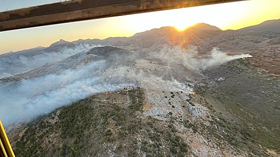 Nine aircraft dispatched to ramp up efforts to control wildfire near inland Malaga village as strong winds fan flames