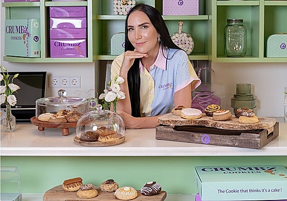 Debbie Wingham, considered one of the top ten cake creators, poses with some of her creations.