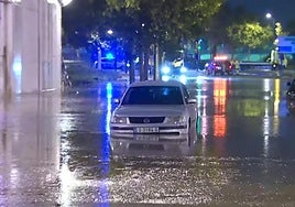 A car stranded under a flooded bridge in the Spanish province of Zaragoza.