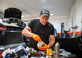A self-employed businessman, running his independent vehicle repair shop.
