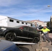 File image of an abandoned vehicle being towed away.