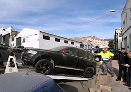 File image of an abandoned vehicle being towed away.