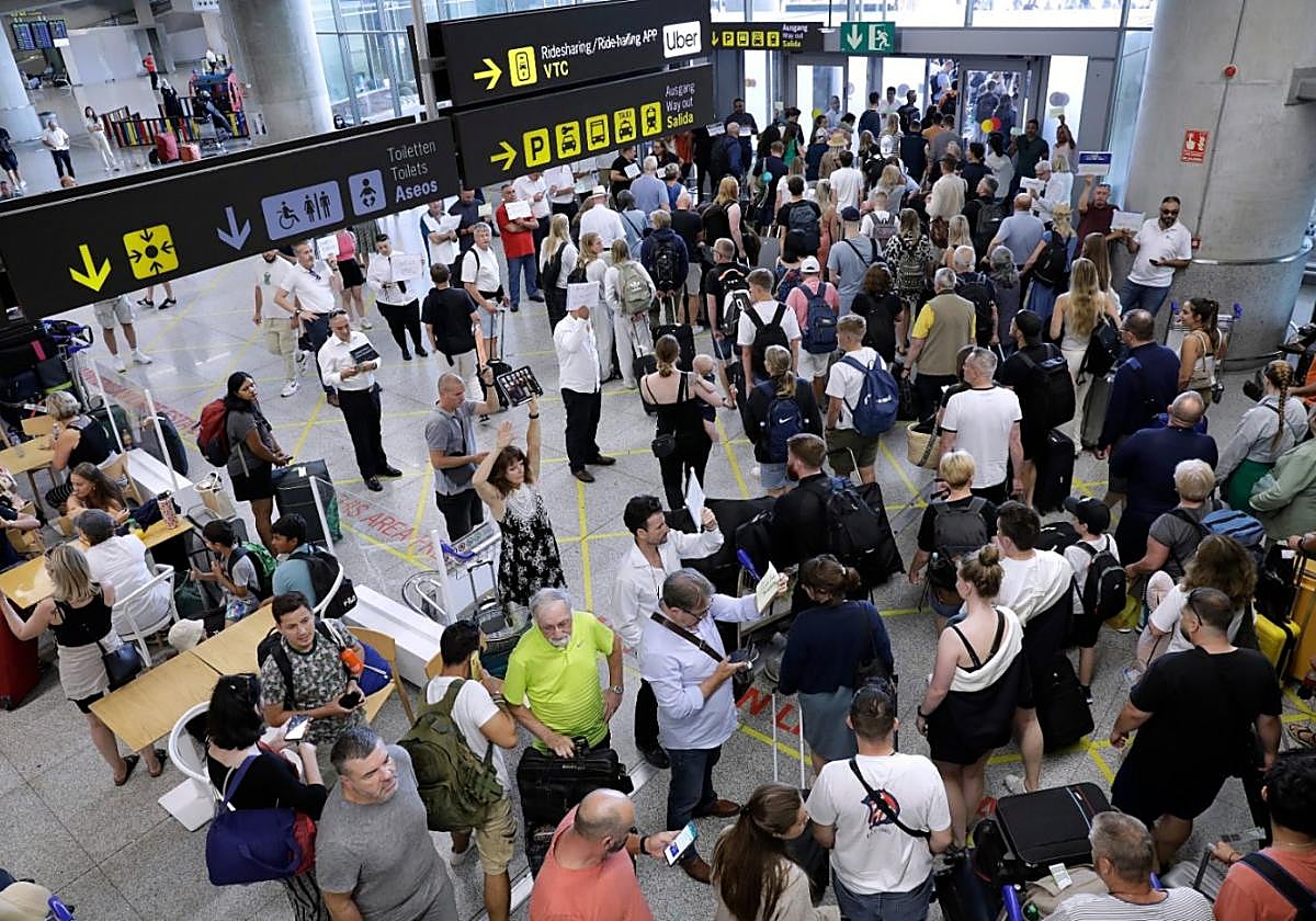 The busy arrivals hall at Malaga Airport.