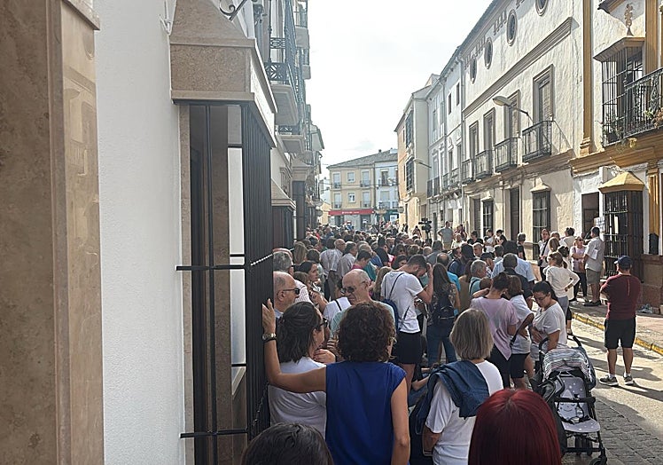 Residents gather around Fran Custodio's house.