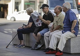 Pensioners watching the world go by while sitting on a bench.