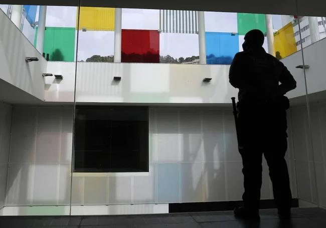 A security guard watches over the iconic Cube at the Centre Pompidou in Malaga.