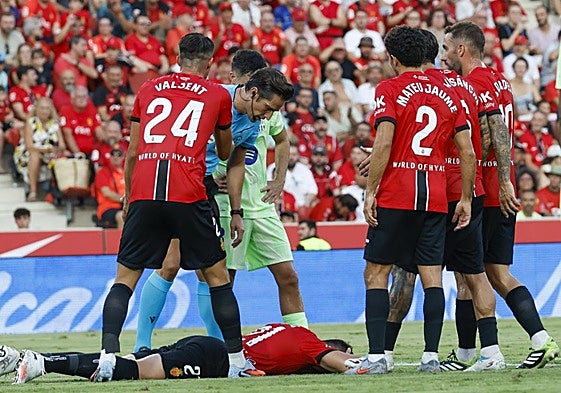 Antonio Raillo on the ground after stopping the ball with his head.