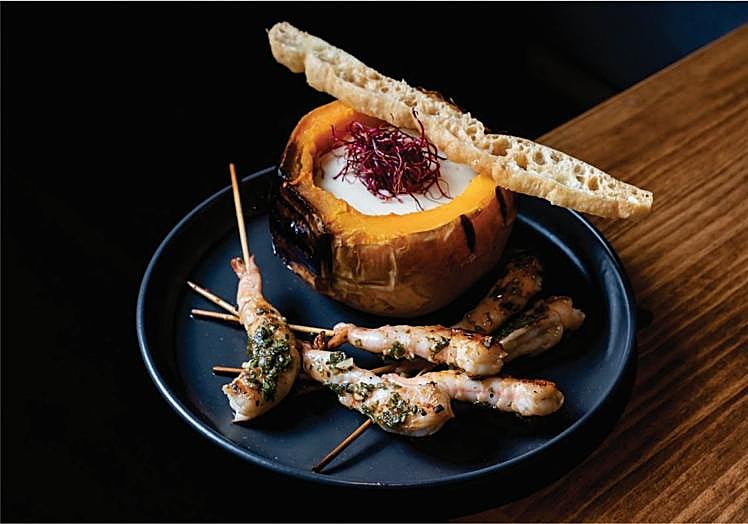 Roasted pumpkin fondue with prawn skewer, chimichurri and baked bread.
