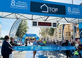 Winner of the men's category Alejandro Caña crosses the finish line.