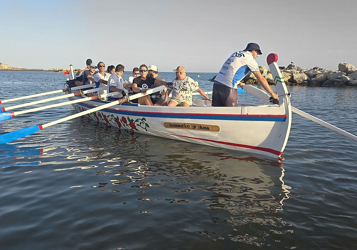 The Jabegotes de la Bahía, debuting their boat now it has been restored.