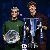 Alcaraz and Sinner with their respective trophies.