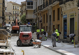 Construction workers at work in Malaga.
