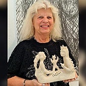 Sculptor Anette Skou with one of her pieces.