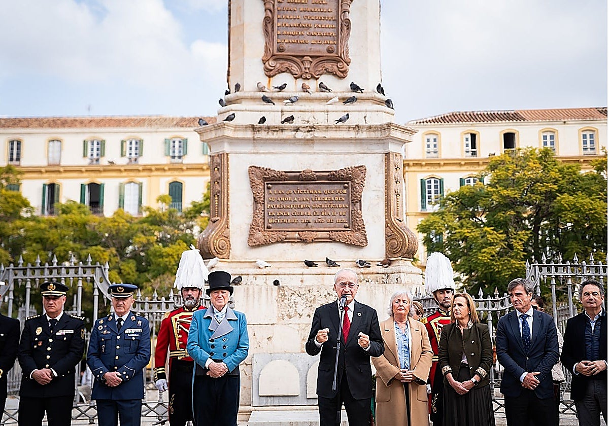 The mayor and the authorities, in front of the monolith in memory of those shot in the Plaza de la Merced.