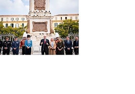 The mayor and the authorities, in front of the monolith in memory of those shot in the Plaza de la Merced.