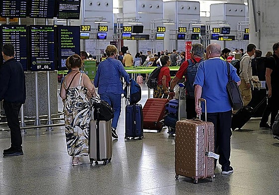 Passengers waiting at Malaga airport.