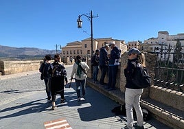 Visitors strolling through the historic centre of Ronda.