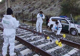 Forensic experts from the Guardia Civil investigate one of the "breaks" found on the tracks.